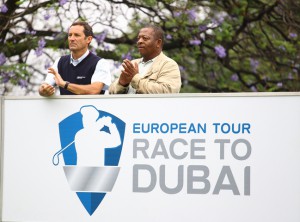 21-11-13 . European Tour 2014, South African Open Championship hosted by the City of Ekurhuleni, Glendower GC, Ekerhuleni, Gauteng, South Aafrica. 21-24 Nov. David Williams from the European Tour and Khaya Ngqula behind the new board of the Race to Dubai  during the first round.