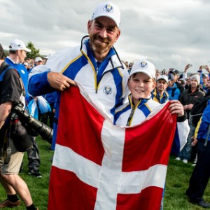 28-09-14 European Tour 2014, 40th RYDER CUP, Gleneagles Resort, PGA Centenary Course, Perthshire, Scotland, UK. 23-28 Sep. EUROPE Team win 16,5 - 11,5:  Thomas  Bjorn of Denmark with flag and his son after the singles matches.